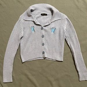 Blue cropped sweater with embroidered butterflies